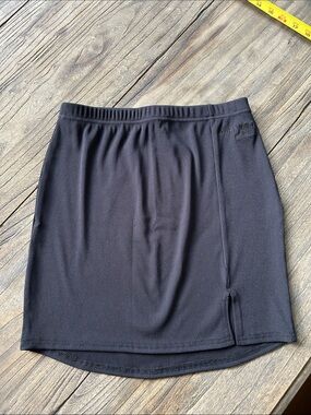 Sleek Black Ribbed Mini Skirt with Subtle Front Slit